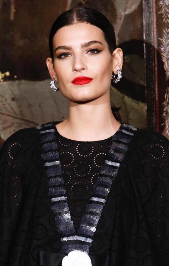 French Evening hair center part slicked back with red lipstick almajodorowsky